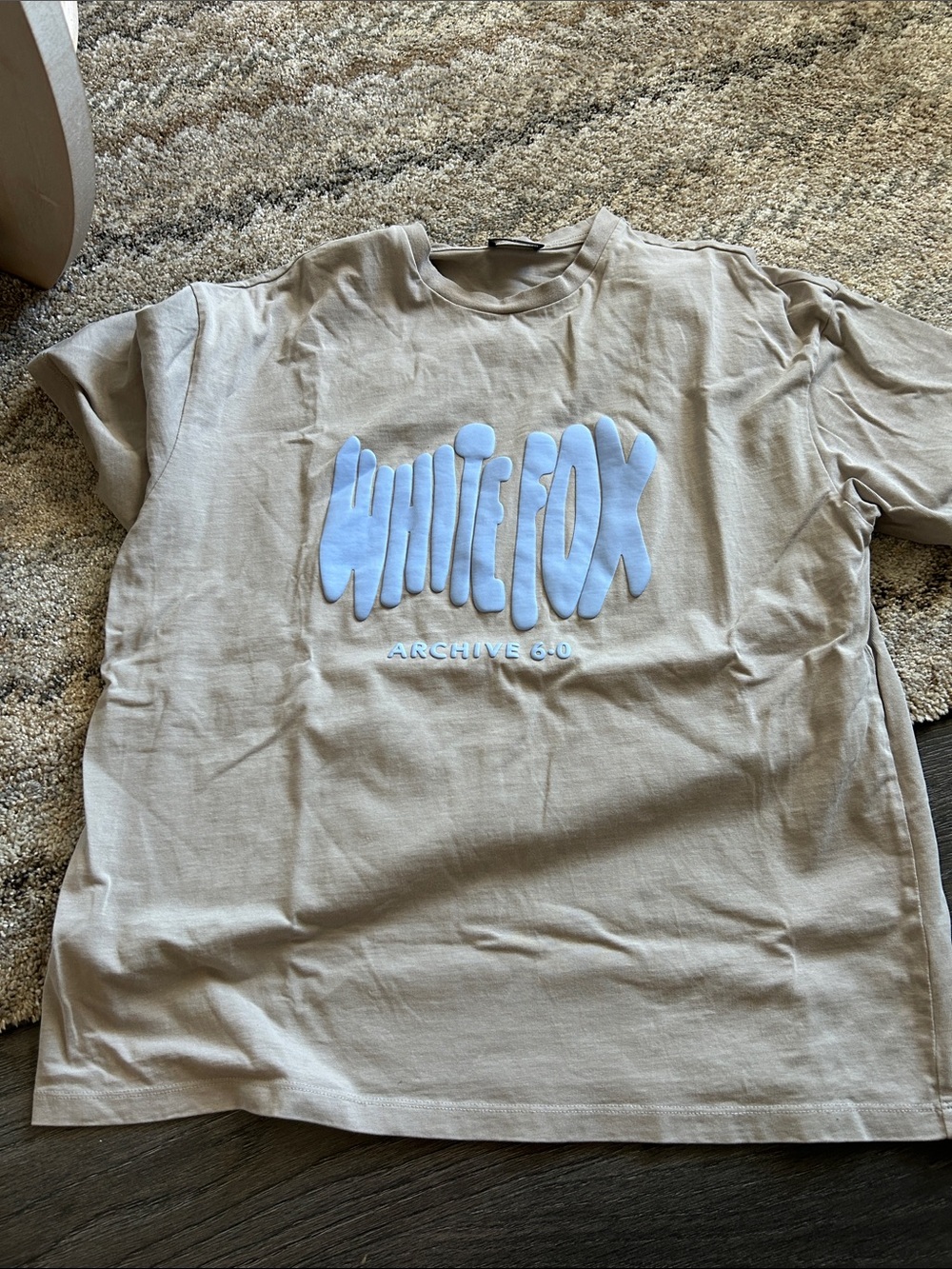White Fox Boutique Beige Tee with Light Blue Raised Logo